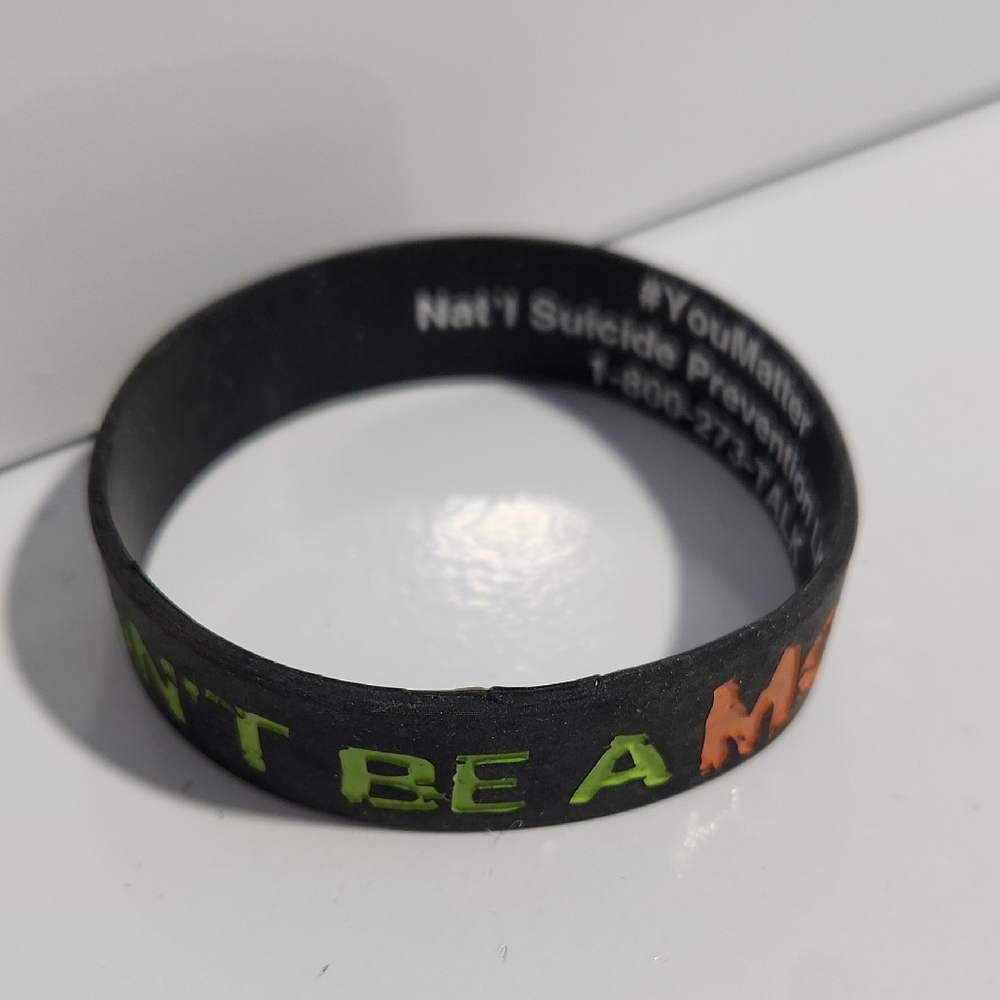 Inspirational Black Silicone Wristband Green and Orange Text "Dont Be A Monster"